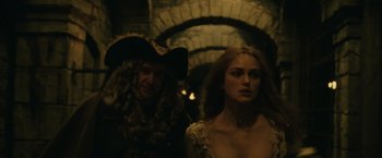 Movie still from “Pirates of the Caribbean: Dead Man's Chest” (2006), directed by Gore Verbinski – A man and a woman dressed as pirates; Medium shot, Over the shoulder angle