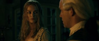 Movie still from “Pirates of the Caribbean: Dead Man's Chest” (2006), directed by Gore Verbinski – A man and a woman standing next to each other in a room; Close Up shot, Over the shoulder angle