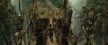 Movie still from “Pirates of the Caribbean: Dead Man's Chest” (2006), directed by Gore Verbinski – A man is walking down a wooden bridge; Extreme Wide shot, High angle