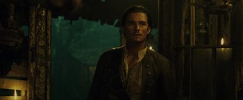 Movie still from “Pirates of the Caribbean: Dead Man's Chest” (2006), directed by Gore Verbinski – A person wearing a jacket; Close Up shot, Over the shoulder angle