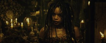 Movie still from “Pirates of the Caribbean: Dead Man's Chest” (2006), directed by Gore Verbinski – A woman with dreads is looking at the camera; Close Up shot, Low angle