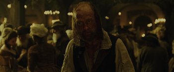 Movie still from “Pirates of the Caribbean: Dead Man's Chest” (2006), directed by Gore Verbinski – A person with a beard; Close Up shot, Over the shoulder angle