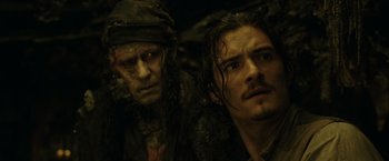 Movie still from “Pirates of the Caribbean: Dead Man's Chest” (2006), directed by Gore Verbinski – Two men are standing next to each other; Close Up shot, Over the shoulder angle