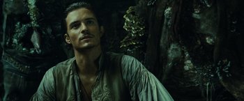 Movie still from “Pirates of the Caribbean: Dead Man's Chest” (2006), directed by Gore Verbinski – A person wearing a shirt; Close Up shot, Over the shoulder angle