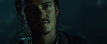Movie still from “Pirates of the Caribbean: Dead Man's Chest” (2006), directed by Gore Verbinski – A person with a beard; Close Up shot, Over the shoulder angle