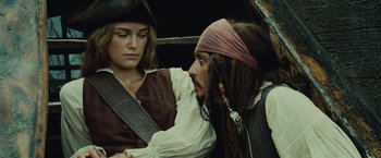 Movie still from “Pirates of the Caribbean: Dead Man's Chest” (2006), directed by Gore Verbinski – A man and a woman dressed in pirate costumes; Close Up shot, Over the shoulder angle