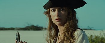 Movie still from “Pirates of the Caribbean: Dead Man's Chest” (2006), directed by Gore Verbinski – A person with long hair wearing a hat; Close Up shot, Low angle