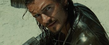 Movie still from “Pirates of the Caribbean: Dead Man's Chest” (2006), directed by Gore Verbinski – Close up of a man with wet hair and blue eyes; Close Up shot, Over the shoulder angle