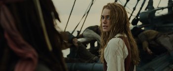 Movie still from “Pirates of the Caribbean: Dead Man's Chest” (2006), directed by Gore Verbinski – A woman with long blonde hair on a boat; Close Up shot, Over the shoulder angle