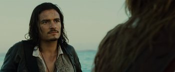 Movie still from “Pirates of the Caribbean: Dead Man's Chest” (2006), directed by Gore Verbinski – A person near a body of water; Close Up shot, Over the shoulder angle