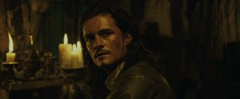 Movie still from “Pirates of the Caribbean: Dead Man's Chest” (2006), directed by Gore Verbinski – A person with long dark hair; Close Up shot, Over the shoulder angle