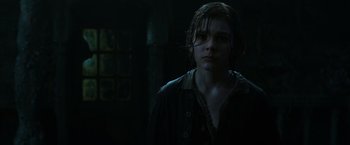 Movie still from “Pirates of the Caribbean: Dead Men Tell No Tales” (2017), directed by Espen Sandberg – A young girl standing in a dark room; Close Up shot, Low angle