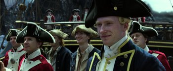 Movie still from “Pirates of the Caribbean: Dead Men Tell No Tales” (2017), directed by Espen Sandberg – A group of men in period costumes standing next to each other; Close Up shot, Over the shoulder angle