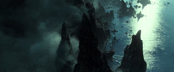 Movie still from “Pirates of the Caribbean: Dead Men Tell No Tales” (2017), directed by Espen Sandberg – An aerial view of a ship in the water; Extreme Wide shot, High angle