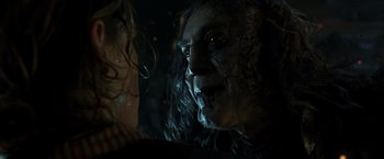 Movie still from “Pirates of the Caribbean: Dead Men Tell No Tales” (2017), directed by Espen Sandberg – The face of an evil looking man; Close Up shot, Over the shoulder angle