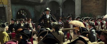Movie still from “Pirates of the Caribbean: Dead Men Tell No Tales” (2017), directed by Espen Sandberg – A group of people sitting around a table; Wide shot, Over the shoulder angle