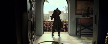 Movie still from “Pirates of the Caribbean: Dead Men Tell No Tales” (2017), directed by Espen Sandberg – Two people are standing in front of an open door; Wide shot, Low angle