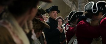 Movie still from “Pirates of the Caribbean: Dead Men Tell No Tales” (2017), directed by Espen Sandberg – A group of people dressed in period clothing; Medium shot, Over the shoulder angle