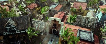 Movie still from “Pirates of the Caribbean: Dead Men Tell No Tales” (2017), directed by Espen Sandberg – An aerial view of a village with a red roof; Extreme Wide shot, High angle