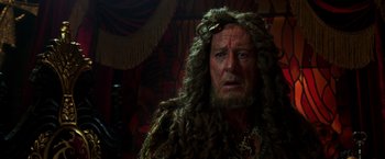 Movie still from “Pirates of the Caribbean: Dead Men Tell No Tales” (2017), directed by Espen Sandberg – A person with long hair and a beard; Close Up shot, Over the shoulder angle