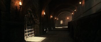 Movie still from “Pirates of the Caribbean: Dead Men Tell No Tales” (2017), directed by Espen Sandberg – A dark room with lights on and a window; Extreme Wide shot, High angle