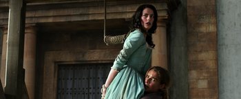 Movie still from “Pirates of the Caribbean: Dead Men Tell No Tales” (2017), directed by Espen Sandberg – A young woman standing next to a young man; Medium shot, Over the shoulder angle