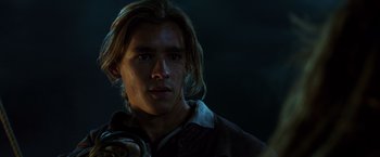 Movie still from “Pirates of the Caribbean: Dead Men Tell No Tales” (2017), directed by Espen Sandberg – A man with long blonde hair is looking at the camera; Close Up shot, Low angle