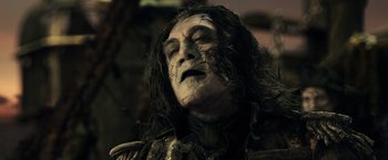 Movie still from “Pirates of the Caribbean: Dead Men Tell No Tales” (2017), directed by Espen Sandberg – A person wearing a costume; Close Up shot, Low angle