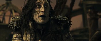 Movie still from “Pirates of the Caribbean: Dead Men Tell No Tales” (2017), directed by Espen Sandberg – A person wearing a costume; Close Up shot, Low angle