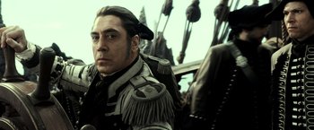 Movie still from “Pirates of the Caribbean: Dead Men Tell No Tales” (2017), directed by Espen Sandberg – A person wearing a uniform; Close Up shot, Low angle