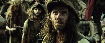 Movie still from “Pirates of the Caribbean: Dead Men Tell No Tales” (2017), directed by Espen Sandberg – A person wearing a hat; Close Up shot, Low angle
