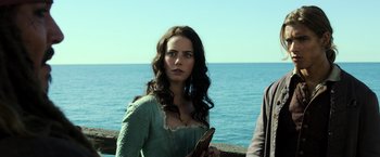 Movie still from “Pirates of the Caribbean: Dead Men Tell No Tales” (2017), directed by Espen Sandberg – A beautiful woman standing in front of a body of water; Close Up shot, Over the shoulder angle