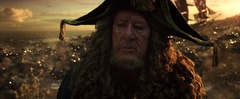 Movie still from “Pirates of the Caribbean: Dead Men Tell No Tales” (2017), directed by Espen Sandberg – A person wearing a hat; Close Up shot, Over the shoulder angle