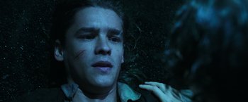 Movie still from “Pirates of the Caribbean: Dead Men Tell No Tales” (2017), directed by Espen Sandberg – A young man with a scar on his face; Close Up shot, Overhead angle