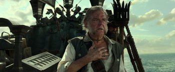 Movie still from “Pirates of the Caribbean: Dead Men Tell No Tales” (2017), directed by Espen Sandberg – An older man with a beard and mustache on; Close Up shot, Low angle