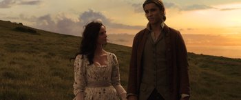 Movie still from “Pirates of the Caribbean: Dead Men Tell No Tales” (2017), directed by Espen Sandberg – A man and a woman standing next to each other holding hands; Medium shot, Low angle