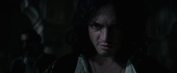 Movie still from “Pirates of the Caribbean: On Stranger Tides” (2011), directed by Rob Marshall – A person with long black hair; Close Up shot, Over the shoulder angle