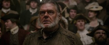 Movie still from “Pirates of the Caribbean: On Stranger Tides” (2011), directed by Rob Marshall – An old man with a beard and a long white beard; Close Up shot, Over the shoulder angle