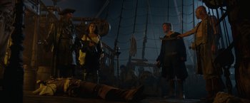 Movie still from “Pirates of the Caribbean: On Stranger Tides” (2011), directed by Rob Marshall – A man and a woman standing next to each other on top of a boat; Wide shot, Low angle