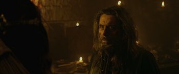 Movie still from “Pirates of the Caribbean: On Stranger Tides” (2011), directed by Rob Marshall – A man with long hair and a long beard; Close Up shot, Over the shoulder angle