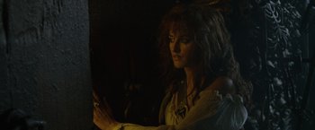 Movie still from “Pirates of the Caribbean: On Stranger Tides” (2011), directed by Rob Marshall – A woman in a white shirt is looking at the camera; Close Up shot, Low angle