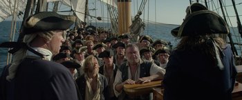 Movie still from “Pirates of the Caribbean: On Stranger Tides” (2011), directed by Rob Marshall – A large group of people on a boat in the ocean; Medium shot, Over the shoulder angle