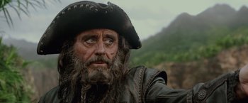 Movie still from “Pirates of the Caribbean: On Stranger Tides” (2011), directed by Rob Marshall – An old man with a beard and a pirate hat; Close Up shot, Low angle