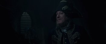 Movie still from “Pirates of the Caribbean: On Stranger Tides” (2011), directed by Rob Marshall – A person wearing a hat; Close Up shot, Over the shoulder angle