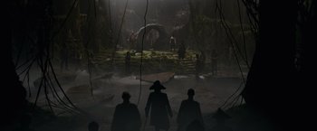 Movie still from “Pirates of the Caribbean: On Stranger Tides” (2011), directed by Rob Marshall – A group of people standing in a forest; Extreme Wide shot, High angle