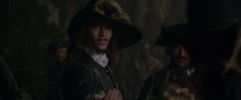 Movie still from “Pirates of the Caribbean: On Stranger Tides” (2011), directed by Rob Marshall – A person wearing a hat; Close Up shot, Over the shoulder angle