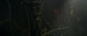 Movie still from “Pirates of the Caribbean: On Stranger Tides” (2011), directed by Rob Marshall – A person standing in front of an old building; Extreme Wide shot, Low angle