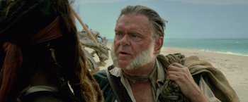Movie still from “Pirates of the Caribbean: On Stranger Tides” (2011), directed by Rob Marshall – An older man with a beard and mustache on; Close Up shot, Low angle