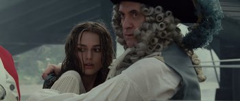Movie still from “Pirates of the Caribbean: The Curse of the Black Pearl” (2003), directed by Gore Verbinski – A man and a woman in renaissance garb looking at each other; Close Up shot, Over the shoulder angle