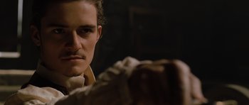 Movie still from “Pirates of the Caribbean: The Curse of the Black Pearl” (2003), directed by Gore Verbinski – A person with a mustache; Close Up shot, Over the shoulder angle